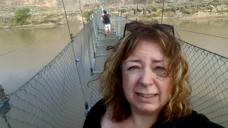 Crossing the Star Mine Suspension Bridge in the Canadian Badlands