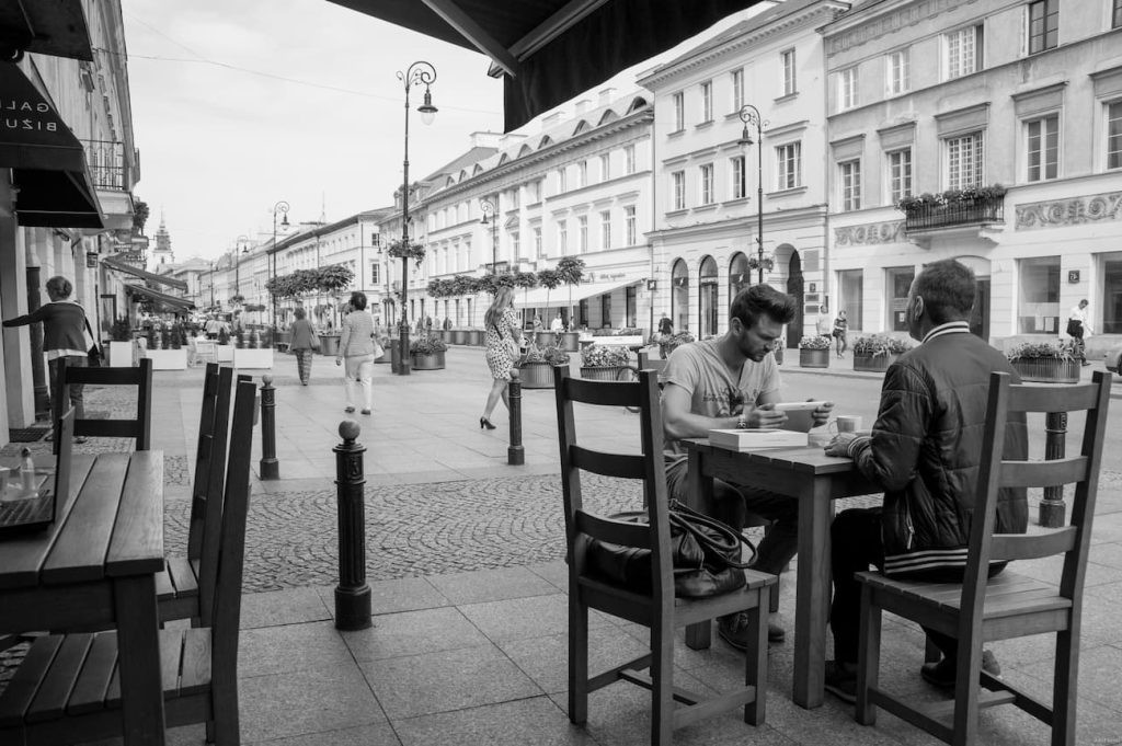 Outdoor café tables along Nowy Świat in Warsaw.