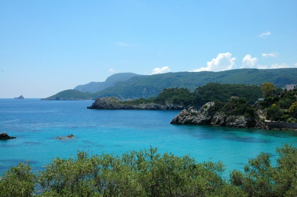 Turquoise water and lush coastline in Paleokastritsa, Corfu