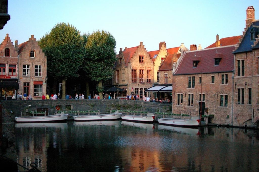 Daytime canal view at Rozenhoedkaai with boats and brick facades