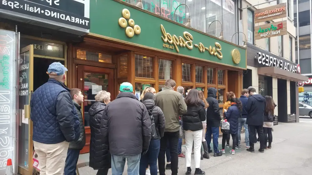 Queue of people outside Ess-a-Bagel in New York City.