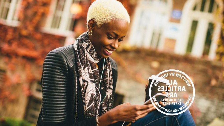 Solo traveler looking out over a scenic destination